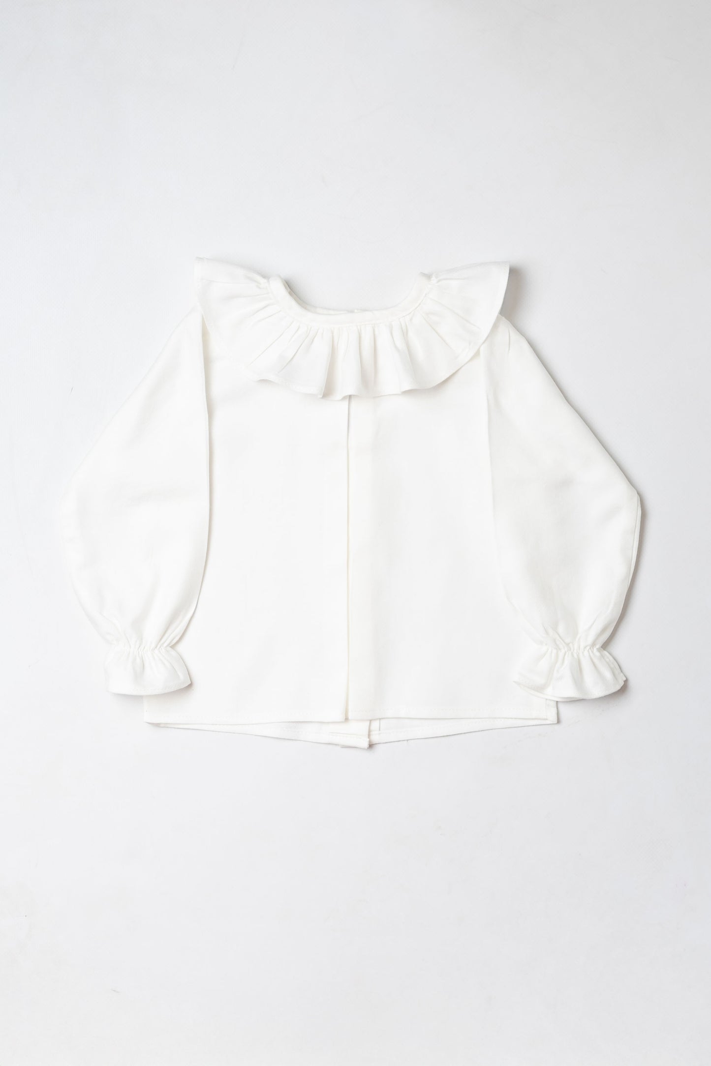 White blouse with ruffles